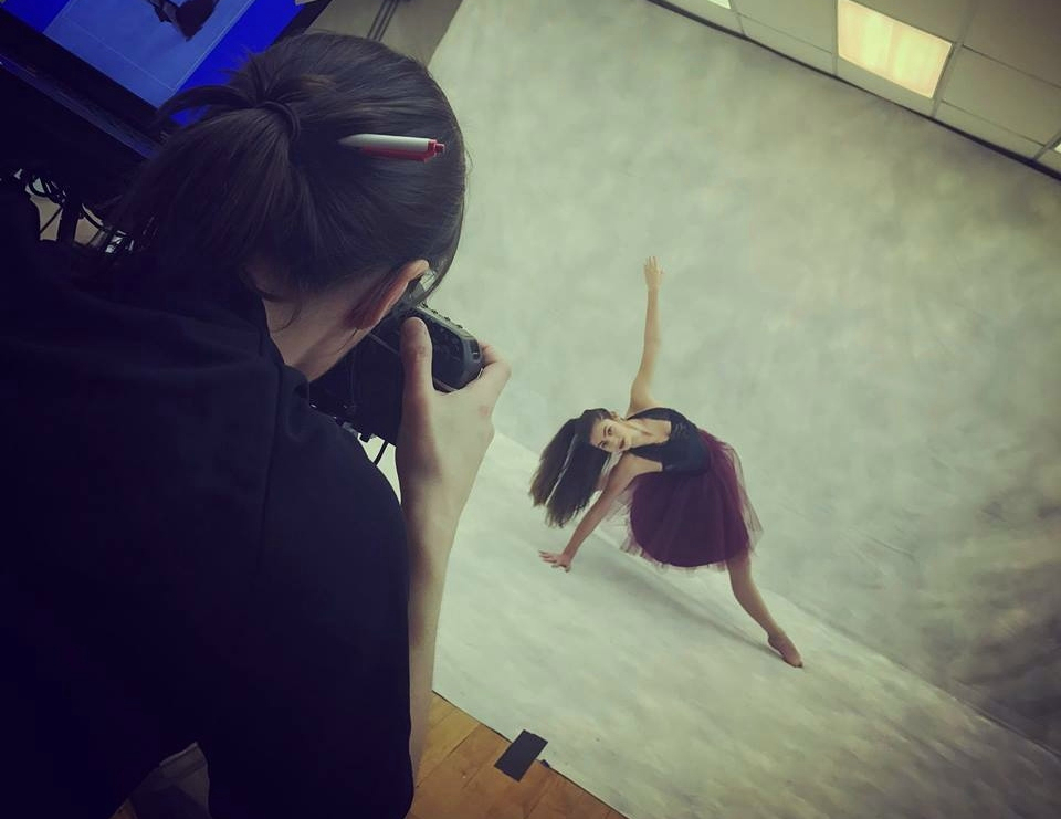 Photographer snaps a photo of a dancer